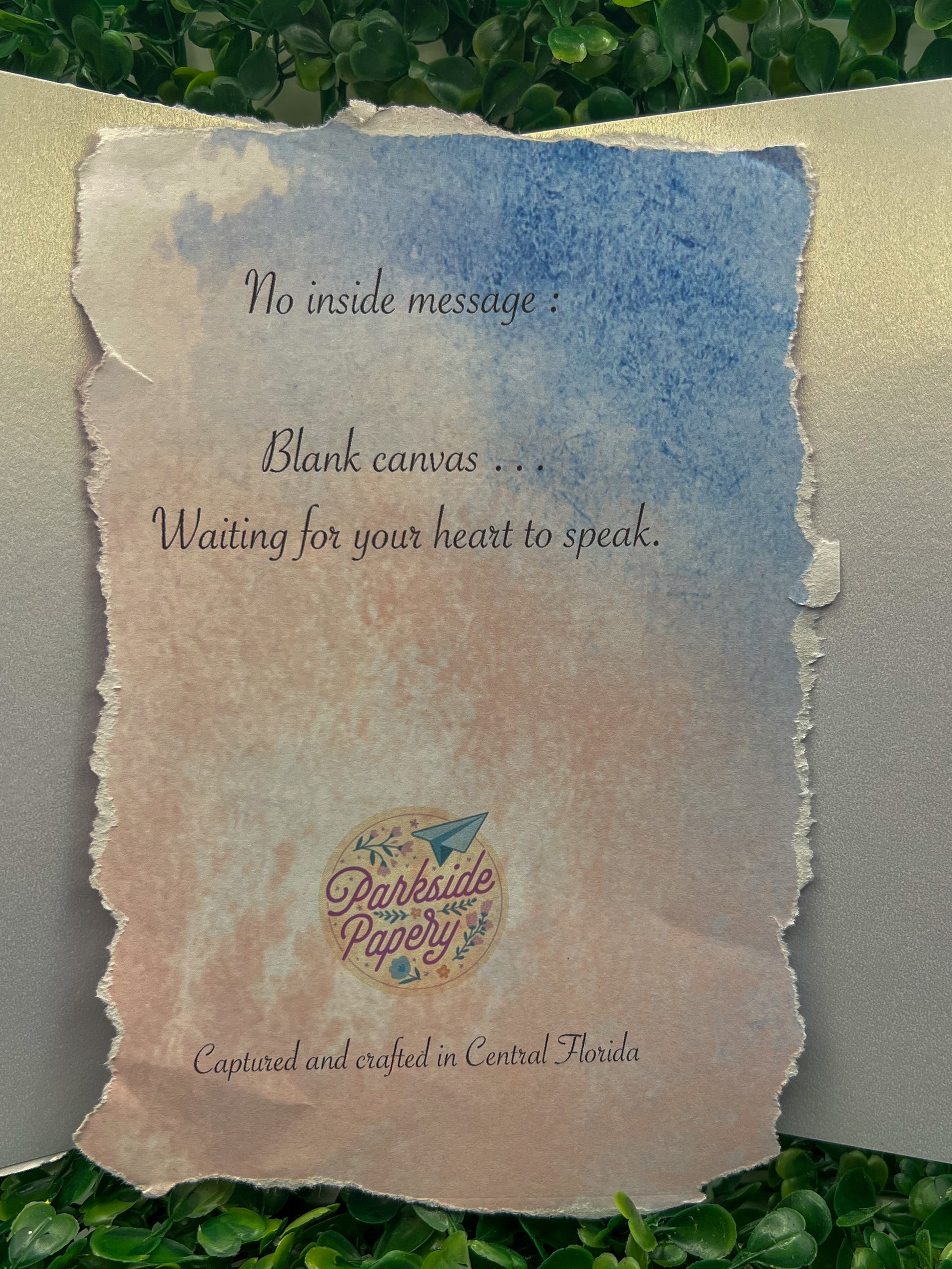 Blank canvas with text and a logo on a textured paper background